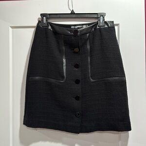 Karl Lagerfeld Paris button front black skirt. Faux leather trim. Size 2